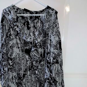 Black in white blouse. Flowery and very lightweight. Will need a cami underneath